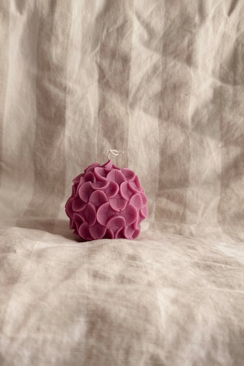 Pink flower on a textured beige & white stripped  fabric background